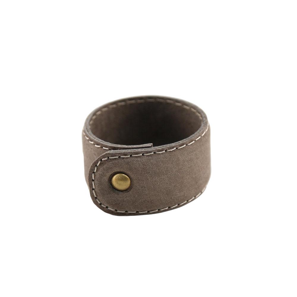 Buffalo leather napkin ring with a stylish button.