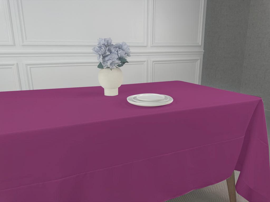 A Polycotton Tablecloth with a plate and vase of flowers, perfect for any table setting. Lightweight and reusable, available in various colors and sizes. Ideal for weddings, dinner parties, and special occasions.