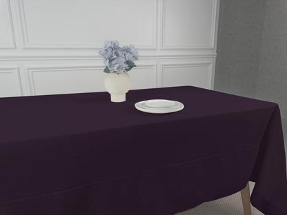 A Polycotton Tablecloth with a vase of flowers as a centerpiece. Perfect for any event, easy to wash and reuse. Available in 3 sizes.