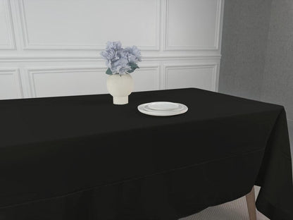 Polycotton Tablecloth with a vase of flowers and a white plate on a black table