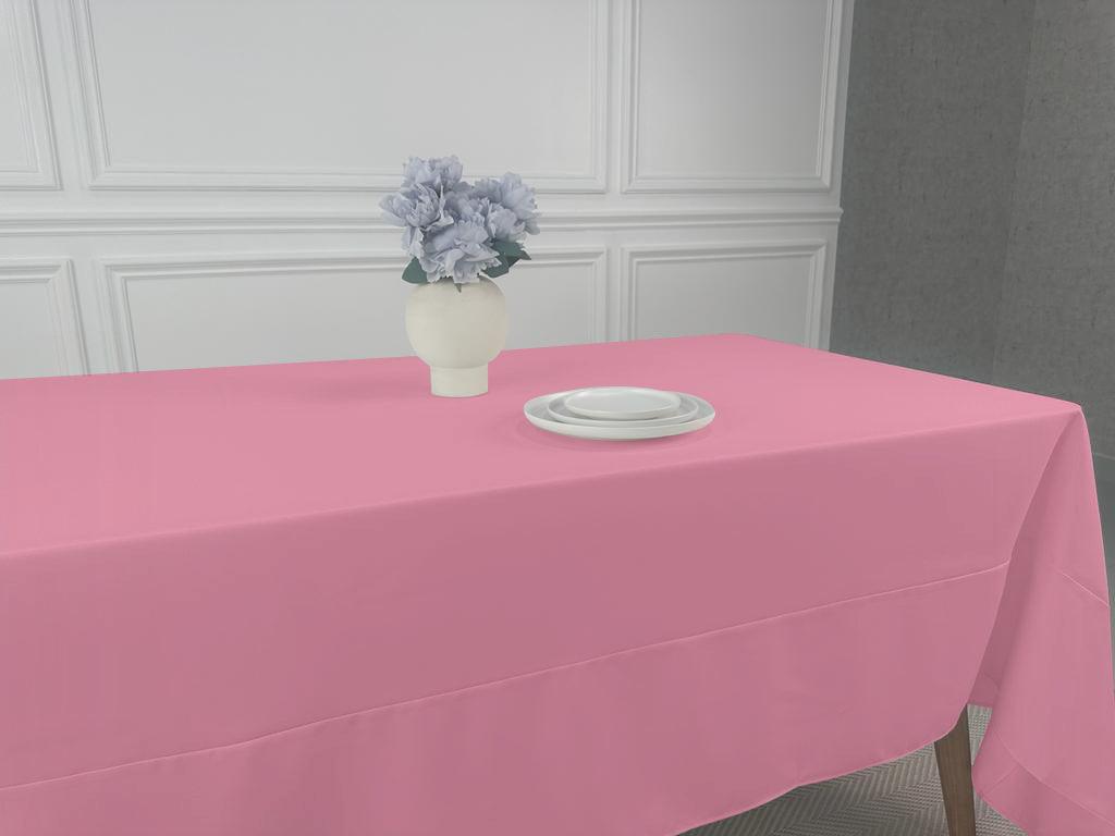 A Polycotton Tablecloth with a vase of flowers and tableware on it, perfect for any event or occasion.