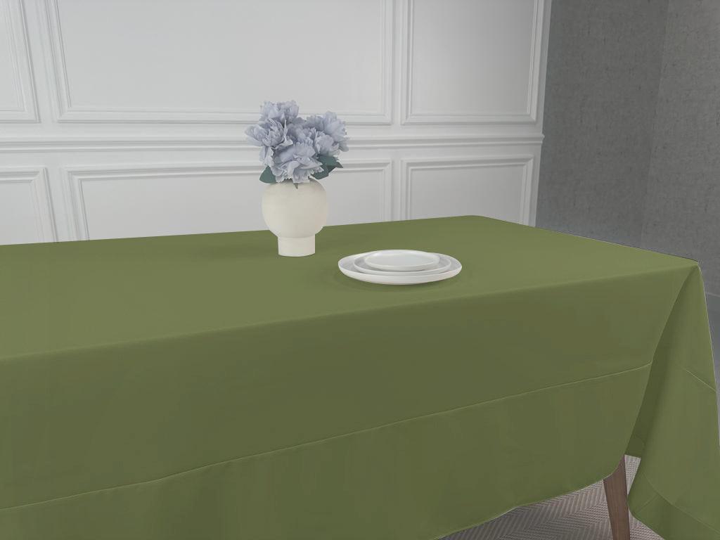 A Polycotton Tablecloth with a vase of flowers on a table.
