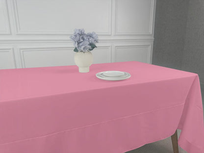 A Polycotton Tablecloth with a vase of flowers and tableware on it. Perfect for any event or occasion. Available in 3 sizes.