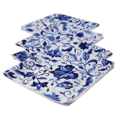 A group of elegant polyester linen dinner napkins with blue and white floral designs. Perfect for adding an elevated look to your table.