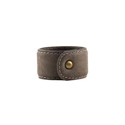 Buffalo Leather Napkin Ring with gold button, perfect for stylish dining.