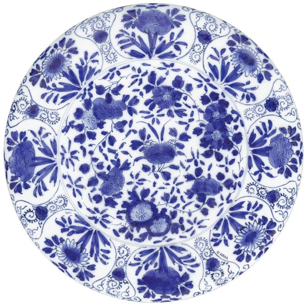 Delft Die-Cut Placemat with blue and white floral pattern, handmade in Vietnam. Adds artful touch to any tabletop, protects surfaces.
