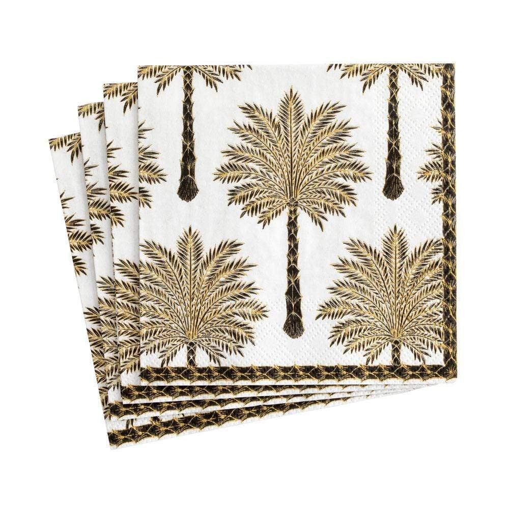 A stack of Grand Palms paper cocktail napkins featuring palm tree designs.